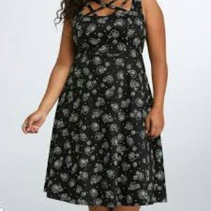 Cool black dress with roses and skulls.